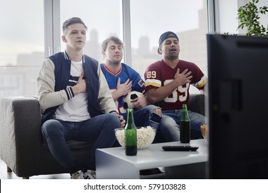 Sports Fan Singing Their National Anthem 
