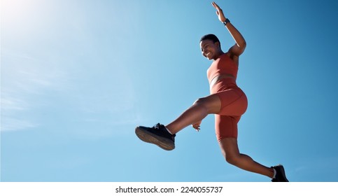 Sports, fitness and black woman jumping with blue sky background from below. Running, exercise and jump, woman training for health goals, motivation and wellness with happy smile and mockup in summer - Powered by Shutterstock