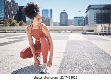 Sports, fitness and black woman tie shoes getting ready for training in city. Face, thinking and female runner tying sneaker lace and preparing for workout jog, running or exercise outdoors on street - Powered by Shutterstock