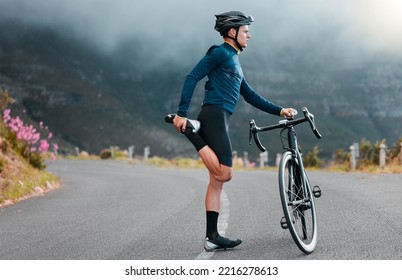 Sports, fitness and man stretching in a road during cycling workout, training and focus in nature. Bike, sport and performance preparation by athletic cyclist doing leg stretch before exercise - Powered by Shutterstock