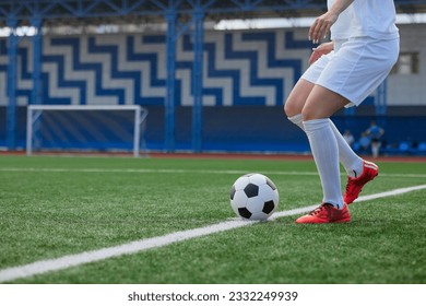 sports girl football player with a soccer ball on the soccer field, the concept of professional women's football - Powered by Shutterstock