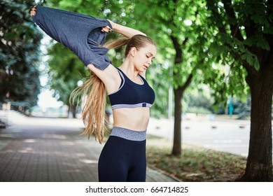 Girl Taking Off Yoga Pants