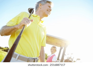 Sports, golf course and mature man with club for game, match and competition on golfing field. Retirement, senior couple and person in morning with smile outdoors for training, hobby and practice - Powered by Shutterstock