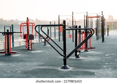 Sports Ground, Outdoor Exercise Machines, Metal Bars, Fitness Training In The Open Air, No People, Morning Dawn. High Quality Photo