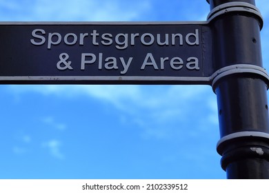 Sports Ground And Play Area Signpost, Road Sign On A Metal Post With A Blue Sky In The Background