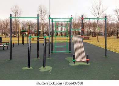 Sports ground with weight training equipment. Sports simulators in the fall. - Shutterstock ID 2086437688