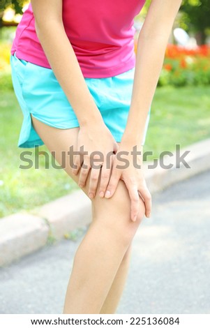 Sports injuries of girl outdoors 