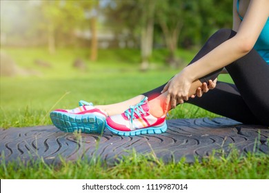 Sports Injuries To Women With Joint Ankle Pain. Young Woman Exercise Model