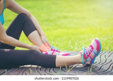 Sports Injuries To Women With Joint Ankle Pain. Young Woman Exercise Model