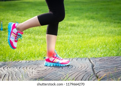 Sports Injuries To Women With Joint Ankle Pain. Young Woman Exercise Model