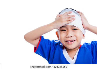 Sports Injury. Youth Athlete Asian Child With Trauma Of The Head Painful Crying And Touching His Forehead.  Boy Has Bandage On Head, Free Form Copy Space. Isolated On White Background. Studio Shot.