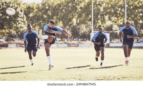 Sports, kick and rugby team on field for training, match or skill development for try and defense. Fitness, outdoor and players with ball for scoring at practice, game or tournament at club stadium. - Powered by Shutterstock