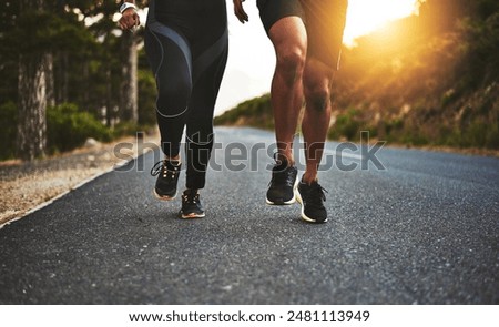 Sports, legs and people running on road for outdoor race or marathon training in mountain. Fitness, friends and body of athletes with cardio workout for endurance exercise in street for practice.