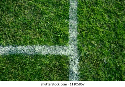 Sports lines painted on a green grassy playing field. - Powered by Shutterstock