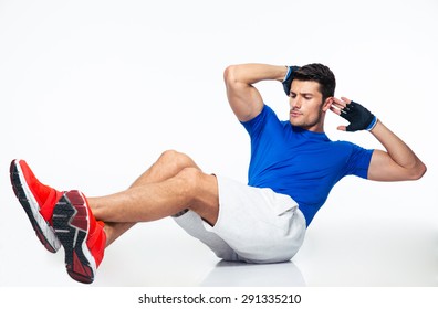 Sports man doing abdominal exercises isolated on a white background