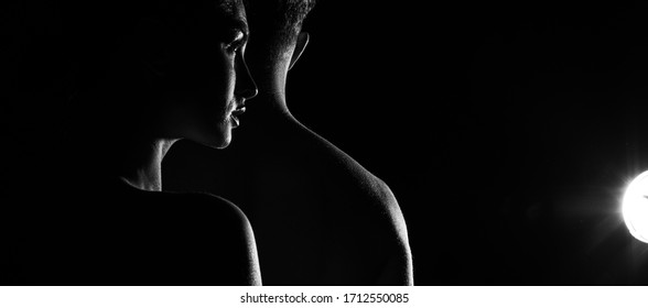 Sports Man And Woman. Silhouettes On A Black Background. Black And White. Couple In Love. Shadow. Dark Background. Love Concept. Romantic Lovers. Lovely. Romance. Female. Face. Silhouette. Fashion. 
