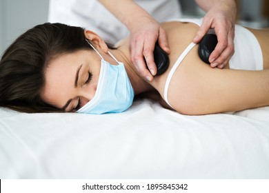 Sports Massage With Hot Stone And Rock Heat In Face Mask