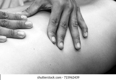 Sports Massage - Shoulder Massage - Physical Therapist Doing Massage Of Shoulders. Black And White Photo, Selective Focus.