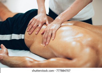 Sports Massage. Therapist Massaging Lower Back