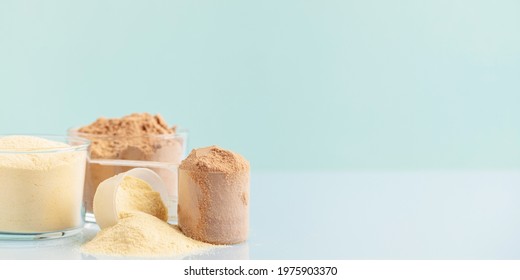 Sports Nutrition, Fitness Diet And Food Concept - Whey And Soy Protein Shake   Powder  On Blue Background