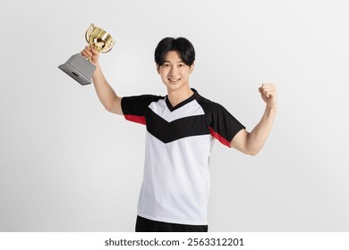 Sports Photo image of a man holding a volleyball trophy