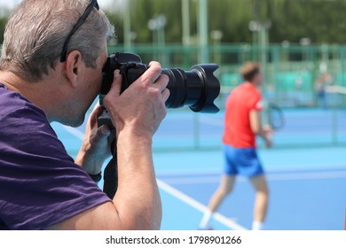 Sports Photographer On The Tennis Court