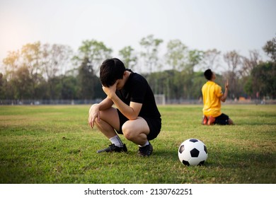 Sports And Recreation A Moment Of Victory And Defeat Of Two Players After The Football Match.