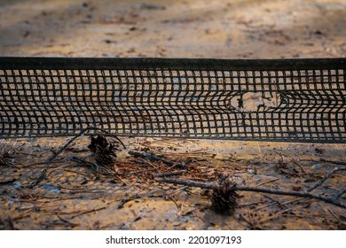 Sports Retro Background. Old Abandoned Tennis Table With A Hole In The Net Close-up.