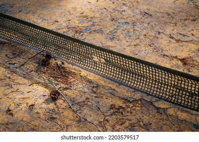 Sports Retro Background. Old Abandoned Tennis Table With A Hole In The Net Close-up.