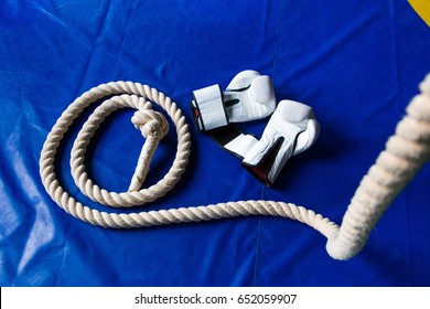Sports rope on the background of boxing gloves and a punching bag. Sports Equipment