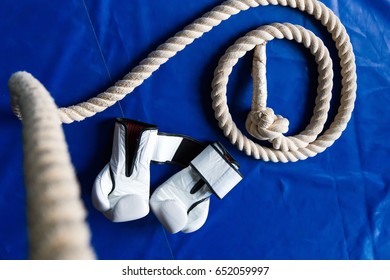 Sports rope on the background of boxing gloves and a punching bag. Sports Equipment