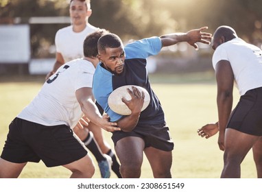 Sports, rugby and men running on field for match, practice and game in tournament or competition. Fitness, teamwork and group of players tackle for exercise, training and performance to win ball - Powered by Shutterstock