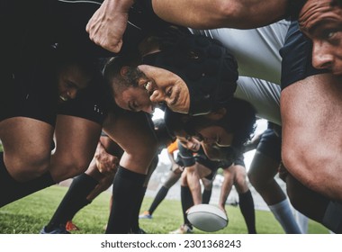 Sports, rugby and players in a scrum on a field during a game, workout or training in a stadium. Fitness, performance and group of athletes in position on an outdoor grass pitch for match or practice - Powered by Shutterstock