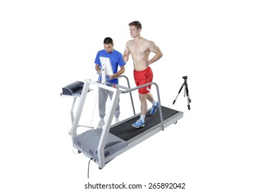 Sports Scientist doing Performance Assessment with Treadmill and High Speed Camera. Modern Technology. - Powered by Shutterstock