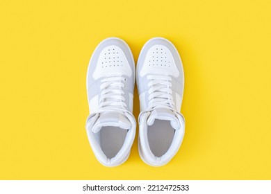 Sports Shoes, Sneakers With Shoelaces On A Yellow Background. Sport Lifestyle Concept Top View Flat Lay.