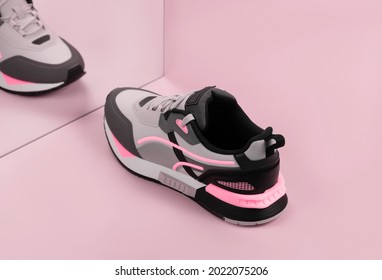 Sports sneakers on a pink background - Powered by Shutterstock