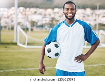 Sports, soccer and portrait of black man with ball and smile on face with motivation for winning game in Africa. Confident, proud and happy professional football player at exercise or training match. - Powered by Shutterstock