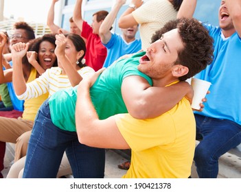 Sports Spectators In Team Colors Celebrating