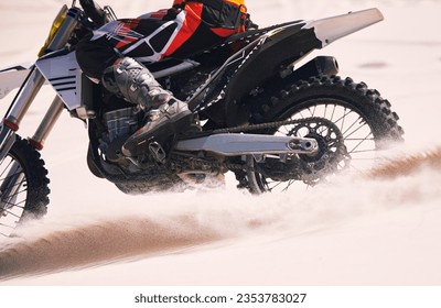 Sports, speed and person on motorbike in desert for training, workout and challenge on sand. Extreme transport, travel and cyclist with motorcycle in action for adventure, freedom and adrenaline - Powered by Shutterstock