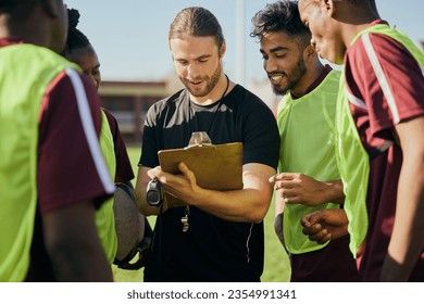 Sports strategy, talking and men in rugby for teamwork, fitness planning or training schedule. Together, field and diversity with group of athlete people with a coach for conversation about a game - Powered by Shutterstock