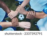 Sports, teamwork and support with hands of soccer player on field for fitness, support and community. Goal, workout and mission with people training on football stadium for motivation and game