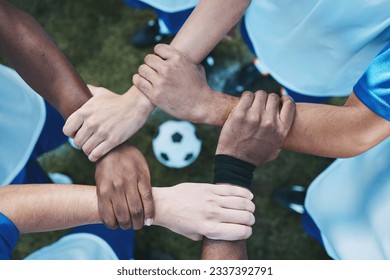 Sports, teamwork and support with hands of soccer player on field for fitness, support and community. Goal, workout and mission with people training on football stadium for motivation and game - Powered by Shutterstock