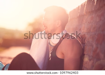 black haired man posing with sunglasses