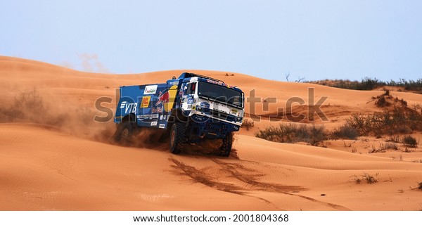 Sports truck KAMAZ gets over the difficult part\
of the route during the Rally raid in sand. THE GOLD OF KAGAN-2021.\
26.04.2021 Astrakhan,\
Russia.