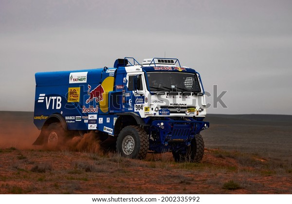 Sports truck KAMAZ gets over the difficult part\
of the route during the Rally raid in sand. THE GOLD OF KAGAN-2021.\
25.04.2021 Astrakhan,\
Russia.