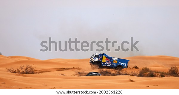 Sports truck KAMAZ gets over the difficult part\
of the route during the Rally raid in sand. THE GOLD OF KAGAN-2021.\
26.04.2021 Astrakhan,\
Russia.