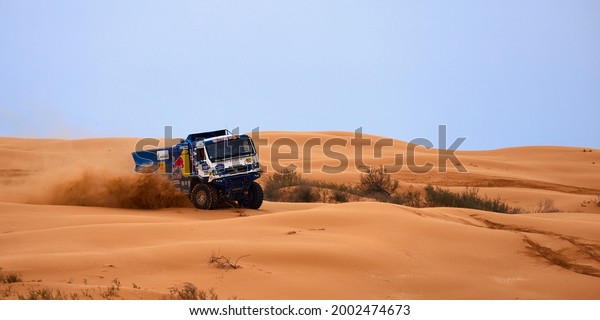 Sports truck KAMAZ gets over the difficult part
of the route during the Rally raid in sand. THE GOLD OF KAGAN-2021.
26.04.2021 Astrakhan,
Russia.