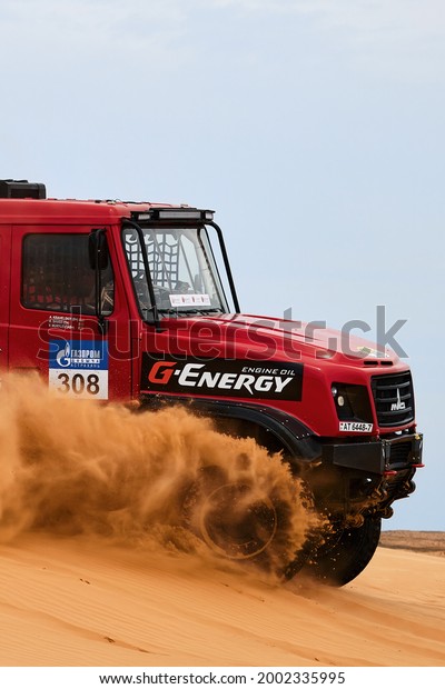 Sports truck MAZ Sport-auto team gets\
over the difficult part of the route during the Rally raid in sand.\
THE GOLD OF KAGAN-2021. 26.04.2021 Astrakhan,\
Russia.
