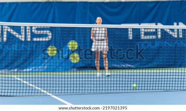 Sports\
TV Broadcast of Female Tennis Championship Match. Professional\
Woman Athlete Compete, Hits Fault Shot Ball into the Net, Loses\
Game. Upset Sportswoman Walks Through the\
Court.