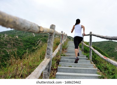 Sports Woman Running On Mountain Stairs 